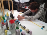 Grace arranges Paper Punk pieces for her stop-motion Kickstarter promo.